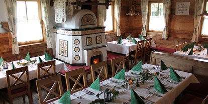 Essen-gehen - Art der Küche: österreichisch - Salzburg - Urige Atmosphäre am wohlig warmen Kachelofen. Ideal auch für Feiern! - Gasthaus Krallinger