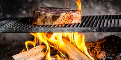 Essen-gehen - Ambiente: urig - Die besten Steaks vom offenen Grill im Restaurant Ainkehr am Katschberg. - Restaurant Ainkehr Katschberg