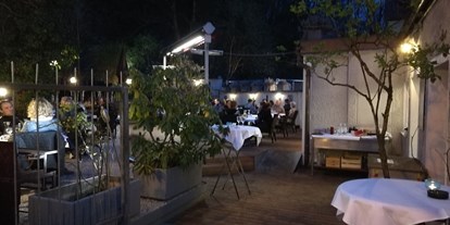Essen-gehen - Art der Küche: mediterran - Tennengau - Gastgarten neben dem Restaurant - Osteria Cavalli