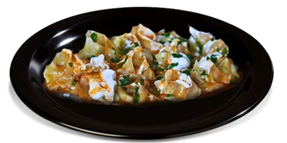 Essen-gehen - Ambiente: klassisch - MANTO is a delicious dish in Central Asian countries and Afghanistan. It is stuffed with meat and steamed. It is served with a mixture of flavored yogurt and a special sauce. - BARAN Restaurant